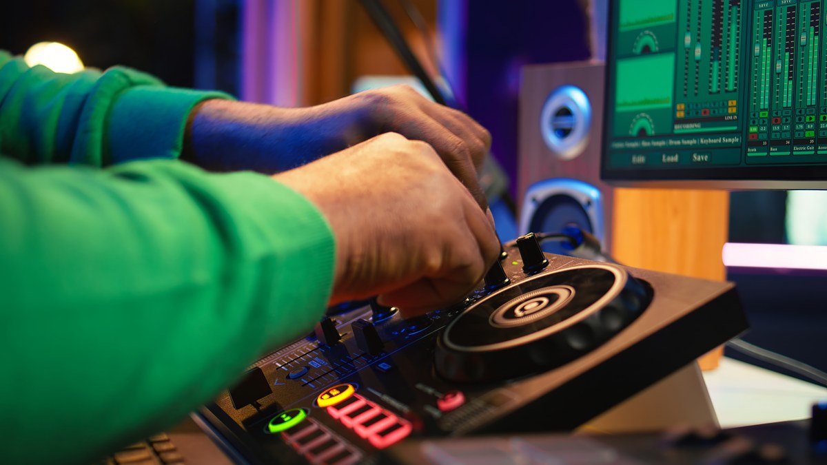 DJ mixing console turntable audio mixer sharing SoundCloud mix link on mobile phone