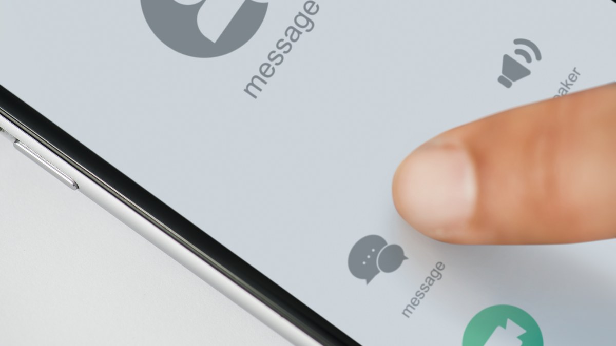 Smartphone displaying WhatsApp chat conversation with Instagram profile link