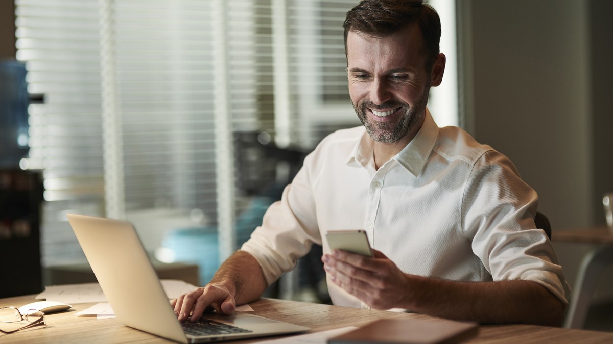 Business professional using linkedin on mobile smartphone in modern office setting