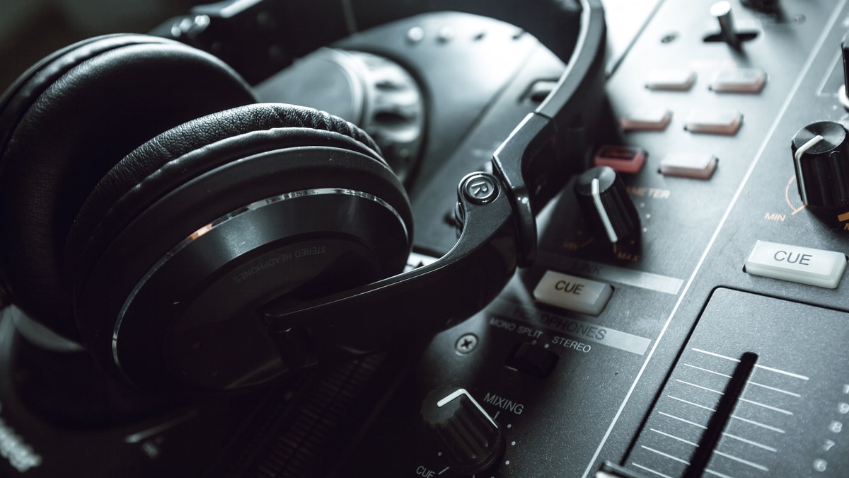 Professional music recording studio with audio mixer headphones and acoustic panels