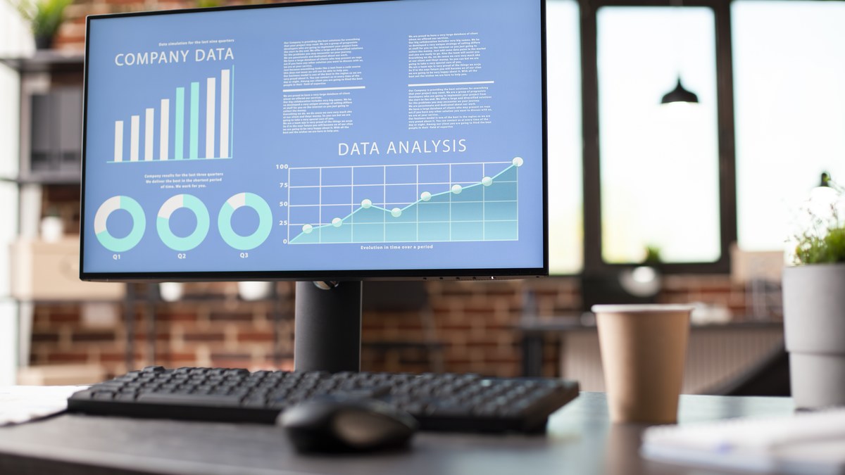 Digital marketing dashboard on a tablet displaying link click charts, referrer pie charts, and geographic analytics