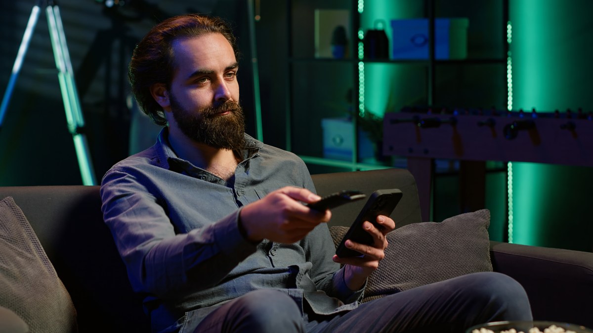 Person watching video content on mobile smartphone screen